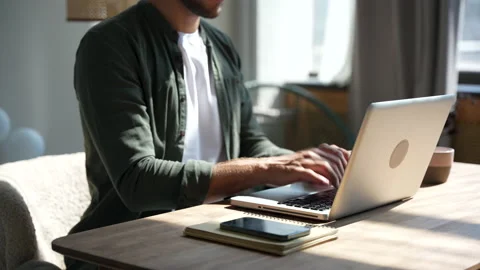 Young man freelancer using laptop online working from home in internet Stock Footage 220867968