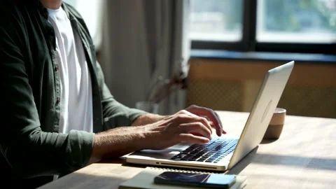 Young man freelancer using laptop online working from home in internet Stock Footage 220868069