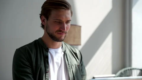 Young man freelancer using laptop online working from home in internet Stock Footage 220868297