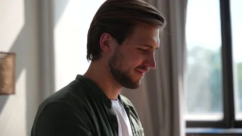 Young man freelancer using laptop online working from home in internet Stock Footage 220868540