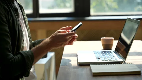Young man freelancer using laptop online working from home in internet Stock Footage 220868923
