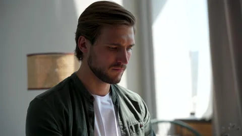 Young man freelancer using laptop online working from home in internet Stock Footage 220868948