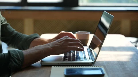 Young man freelancer using laptop online working from home in internet Stock Footage 220869281