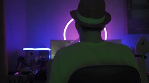 Young man freelancer works at a computer late at night and smokes a hookah while Stock Footage 130127634