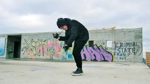 Young man funny dancing on graffiti background Stock Footage 82793357