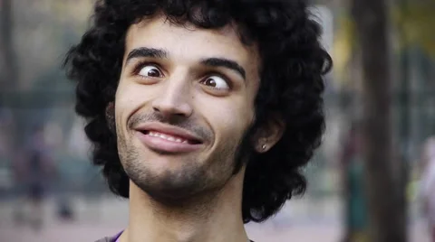 Young man funny face squinting skew eyed eye HD Stock Footage 954488