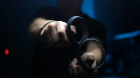 Young man gamer playing in Virtual Reality with VR Controllers in dark room Stock Footage 112761505
