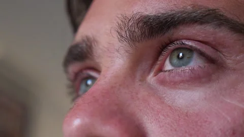 Young man gazes sideways with caution toward the future Stock Footage 321541400