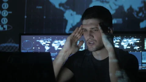 Young Man geek hacker overworking at computer and suffers from a headache in 스톡 동영상 87364042