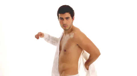 Young man get dressed Stock Footage 24635477