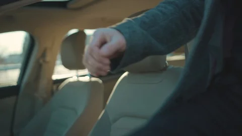 Young man gets in the car coughs wearing Protective Face Mask COVID-19 Stock-Footage 126618592