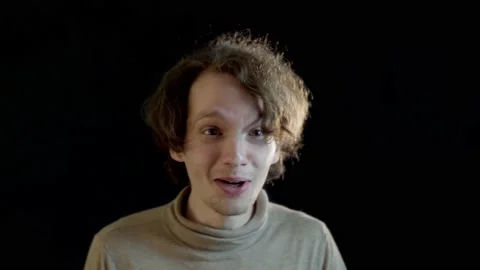 A young man gets a funny fright Stock Footage 220320778