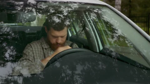 Young man getting in car and fastening seat belt to drive car. Adult male buckle Video stock 199485045