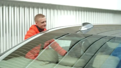 Young man getting in the car Video stock 201164923