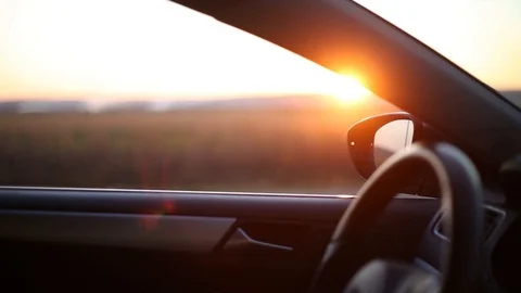 Young man, getting in the car, sunlight effect of sunset.	 Stock Footage 122637125