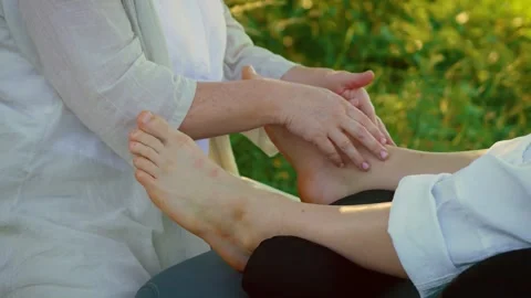 Young man getting leg and feet massage. Body relaxation and foot skin care under Stock Footage 301994480