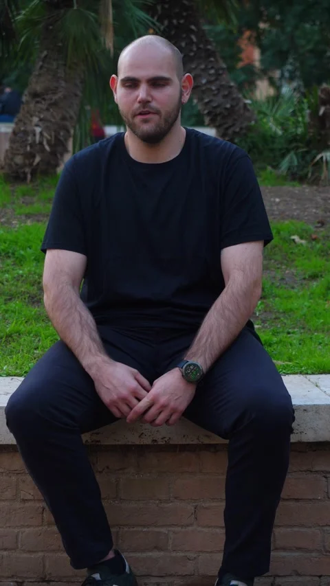 Young man getting nervous while waiting for someone who's late Stock Footage 289002882
