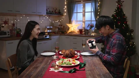 Young man getting present from loving woman Stock-Footage 163794112