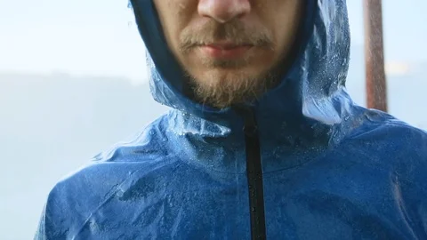 Young man getting wet under the rain. Stock Footage 87987702