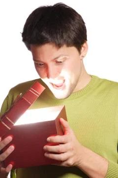 Young man with a gift box Stock Photos