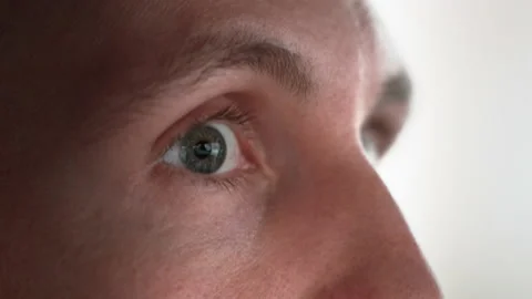 The young man glances from side to side. Close-up Stock Footage 166167434