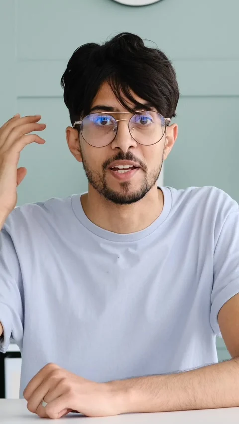 Young Man with Glasses Talking to the Camera in a Video Conference Stock Footage 328129172
