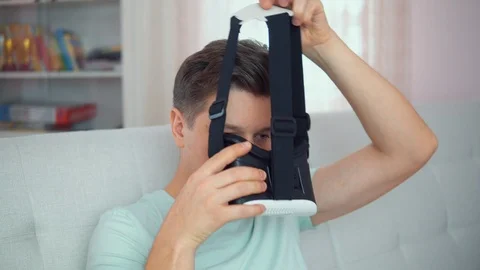 A young man with glasses of virtual reality In a bright interior Video stock 102186669