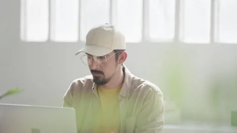 Young man with glasses working remotely form home office. Stock Footage 284847282