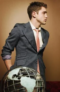 Young Man With Globe Stock Photos