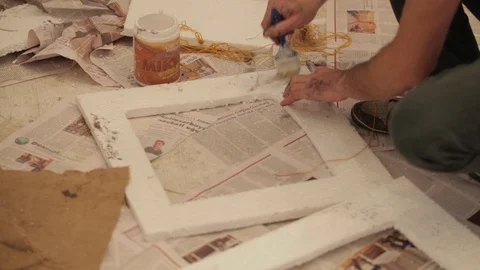 A young man glues the plastic frame Stock Footage 86818252