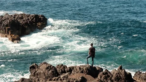 Young man go up on top of mountain summit and watching beautiful ocean landscape Stock Footage 169767114