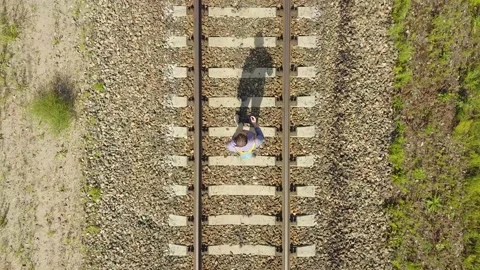A young man goes on rails in the forest. Stock Footage 133622256