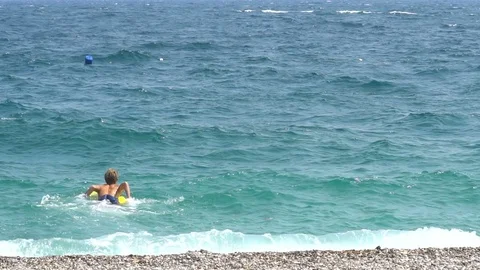 Young man going to the beach while holding surfboard Stock Footage 80311012