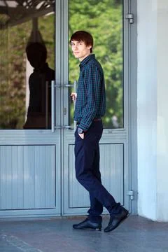 Young man going to enter Stock Photos