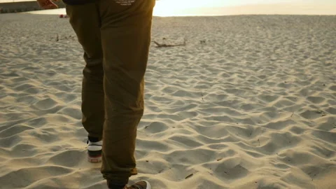 Young man going in the sunlight in beach Stock Footage 96996933