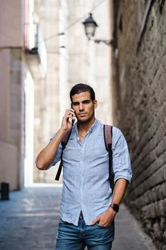 Young man at gothic quarter using smartphone - tourist concept Stock Photos