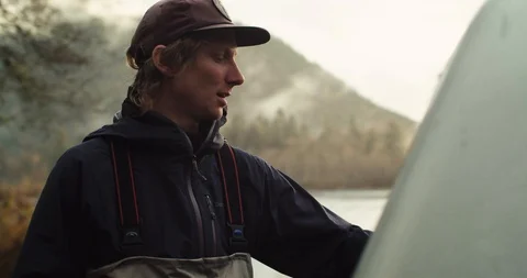 Young man grabs his fly fishing gear Stock-Footage 102188457