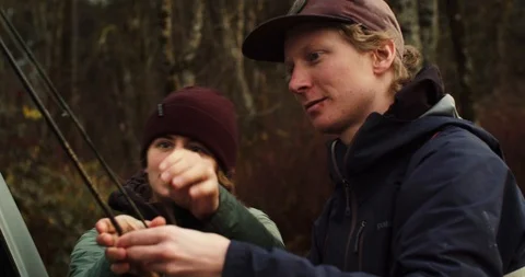 Young man grabs his fly fishing gear Stock Footage 102188490