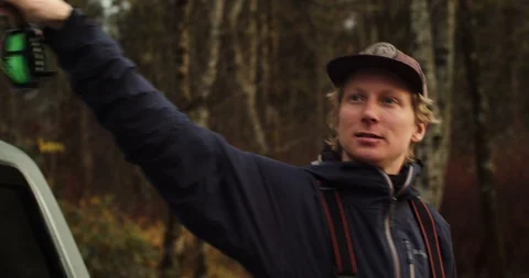 Young man grabs his fly fishing gear Stock Footage 102188548