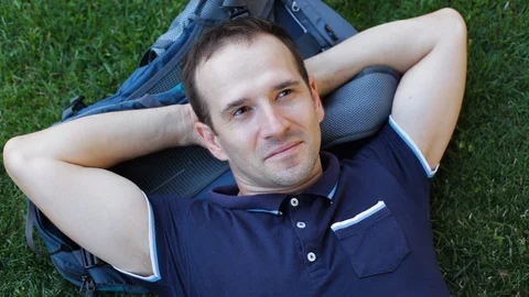 Young man on the grass 4 Stock Footage 120770231