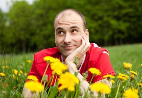 Young man  on the grass Stock Photos
