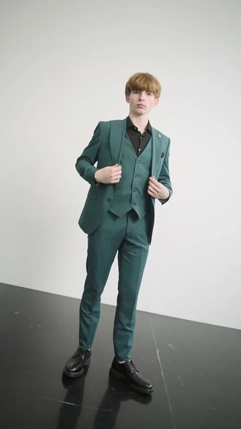 Young man in green suit posing for picture 動画素材 274163101