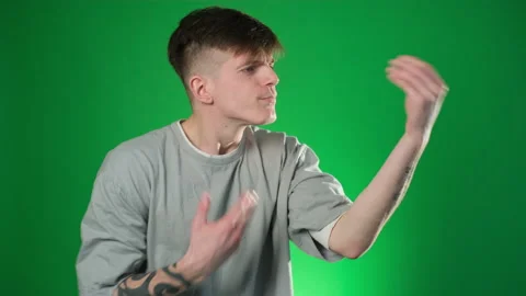 Young man in grey t-shirt showing italian gesture Stock Footage 209133053