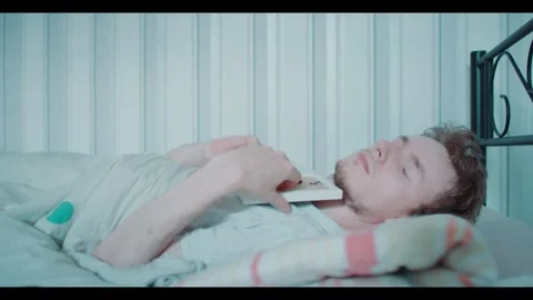 Young Man Grieving over Lost Loved One While Looking at Picture Video stock 341697745