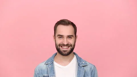Young man guy 20s years old in denim jacket white t-shirt isolated on pastel Stock Footage 136324288