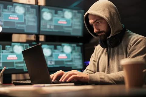 Young man hacking password to break interface Stock Photos