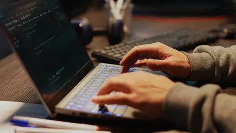 Young man hacking password to break server security Stock Photos
