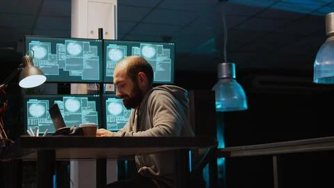 Young man hacking password to break server interface, Stock Photos