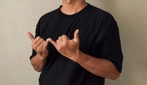 Young man hand gesture about stop sign language to teaching or assist Stock Photos