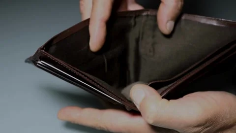 Young Man hand open an empty wallet closeup wallets without money financial Vídeos de archivo 336450378
